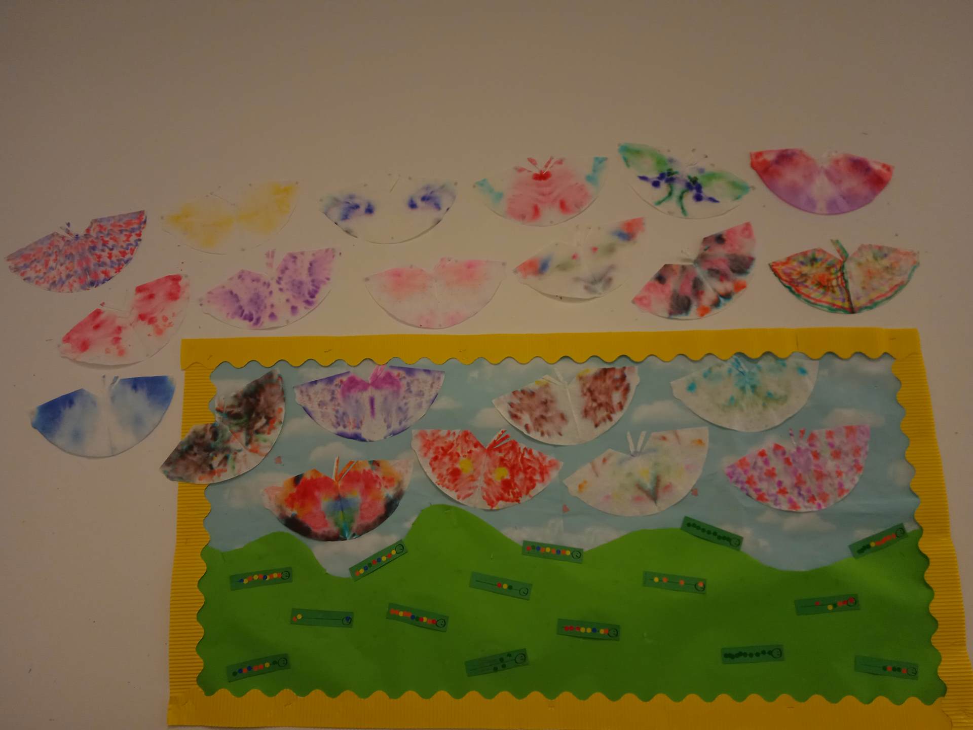 Display with sticker caterpillars and butterflies